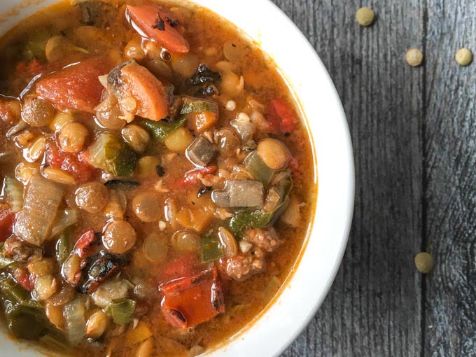 This easy lentil & sausage soup takes no time at all in the Instant Pot. It's a tasty, hearty soup that's more like a meal in a bowl. 