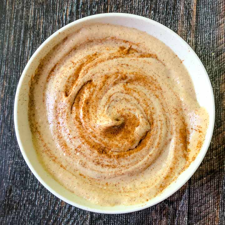 white bowl with low carb cinnamon toast cashew cream cheese spread