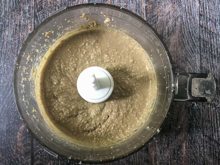 food processor bowl with sunflower seed butter starting to liquify