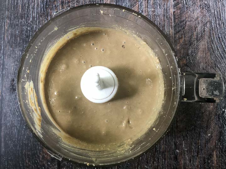 food processor bowl with finished smooth sunflower seed butter