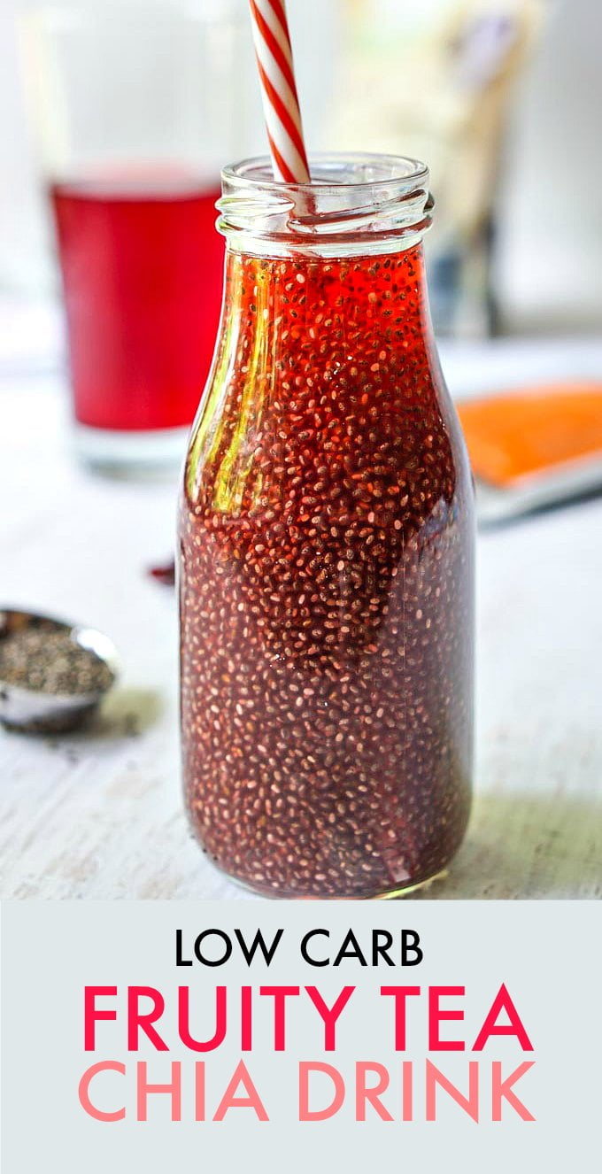Bottle of red chia seed drink with a straw.