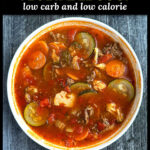 A white bowl of low carb Italian vegetable soup and text overlay.