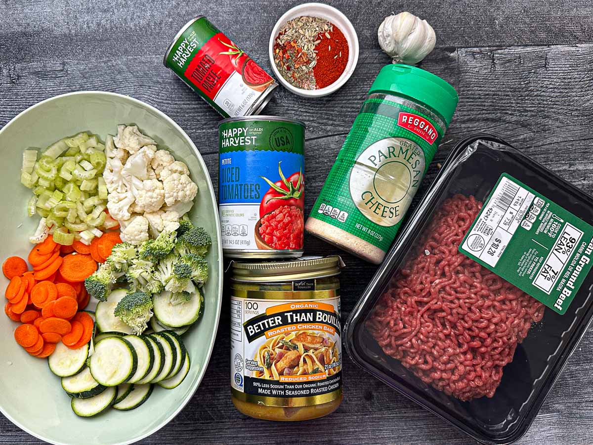 Recipe ingredients - chopped veggies, ground beef, tomato paste, diced tomatoes, better than bouillon, grated cheese, garlic and spices.