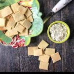 almond flour crackers with cream cheese and green bowl and text