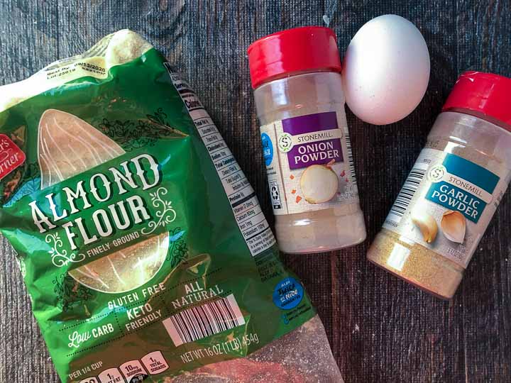 ingredients to make these gluten free crackers - almond flour, onion powder, garlic powder and an egg