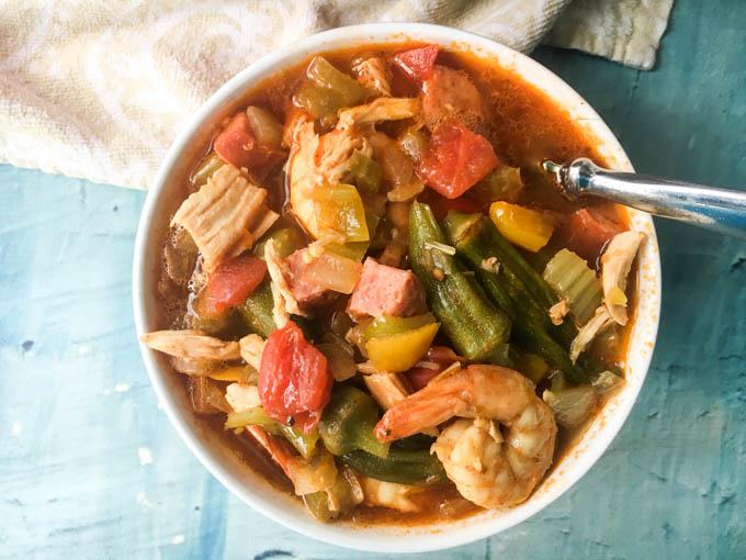 This low carb Jambalaya soup is a delicious combination of shrimp, chicken, sausage and vegetables in a spicy tomato based broth.  Eat as is for a low carb, Paleo soup or over rice for a tasty meal.