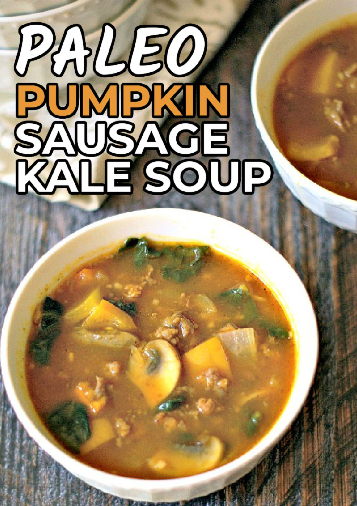 White bowl with easy paleo pumpkin soup with sausage and kale and text.