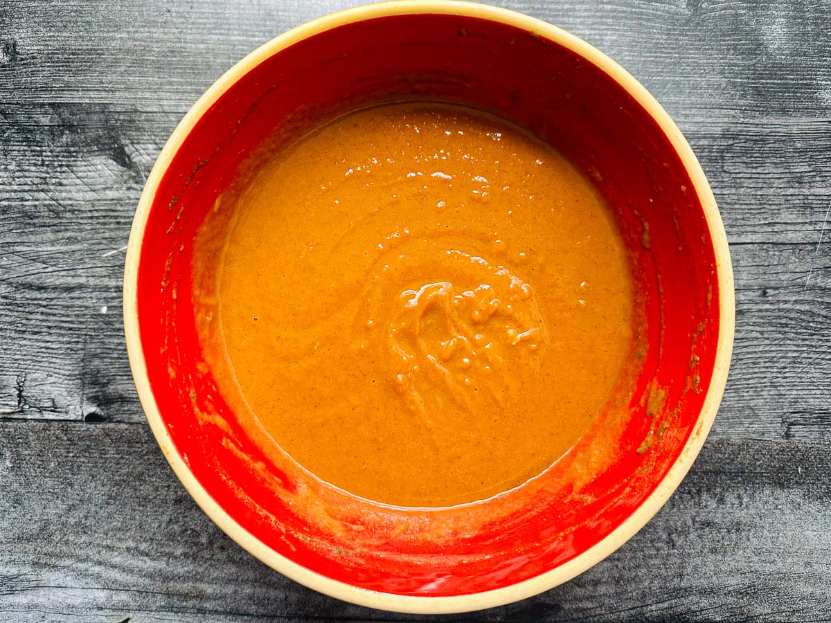 red bowl with pumpkin mixture