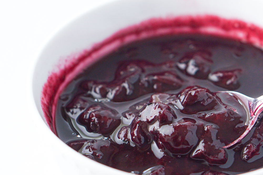 closeup of a spoonful of the keto blueberry topping