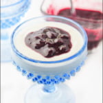 blue glass cup with Instant Pot coconut milk yogurt with berry sauce and text