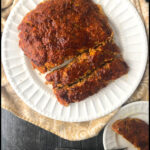 white plate with turkey meatloaf and text