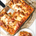 pan and white plate with classic homemade meat lasagna and text