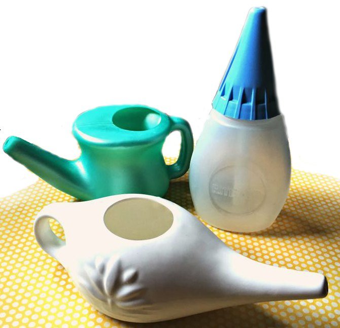 3 different kinds of neti pots on yellow and white polka dot mat