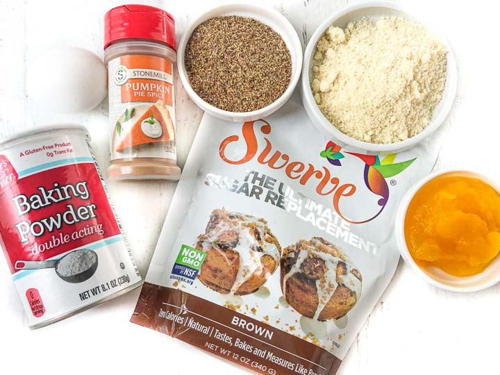ingredients to make this recipe: baking powder, an egg, pumpkin pie spice, flaxseed, almond flour and pumpkin
