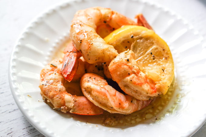 closeup of white plate with a few keto cajun shrimps 