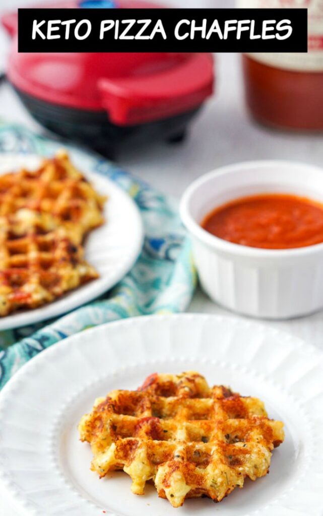 white plate with keto pizza chaffle and a bowl of sauce and waffle iron with text