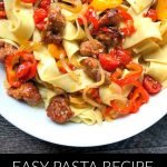 white bowl with pasta with sausage & peppers with text