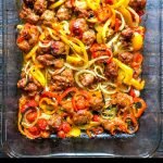 baking dish with pasta with sausage & peppers with text