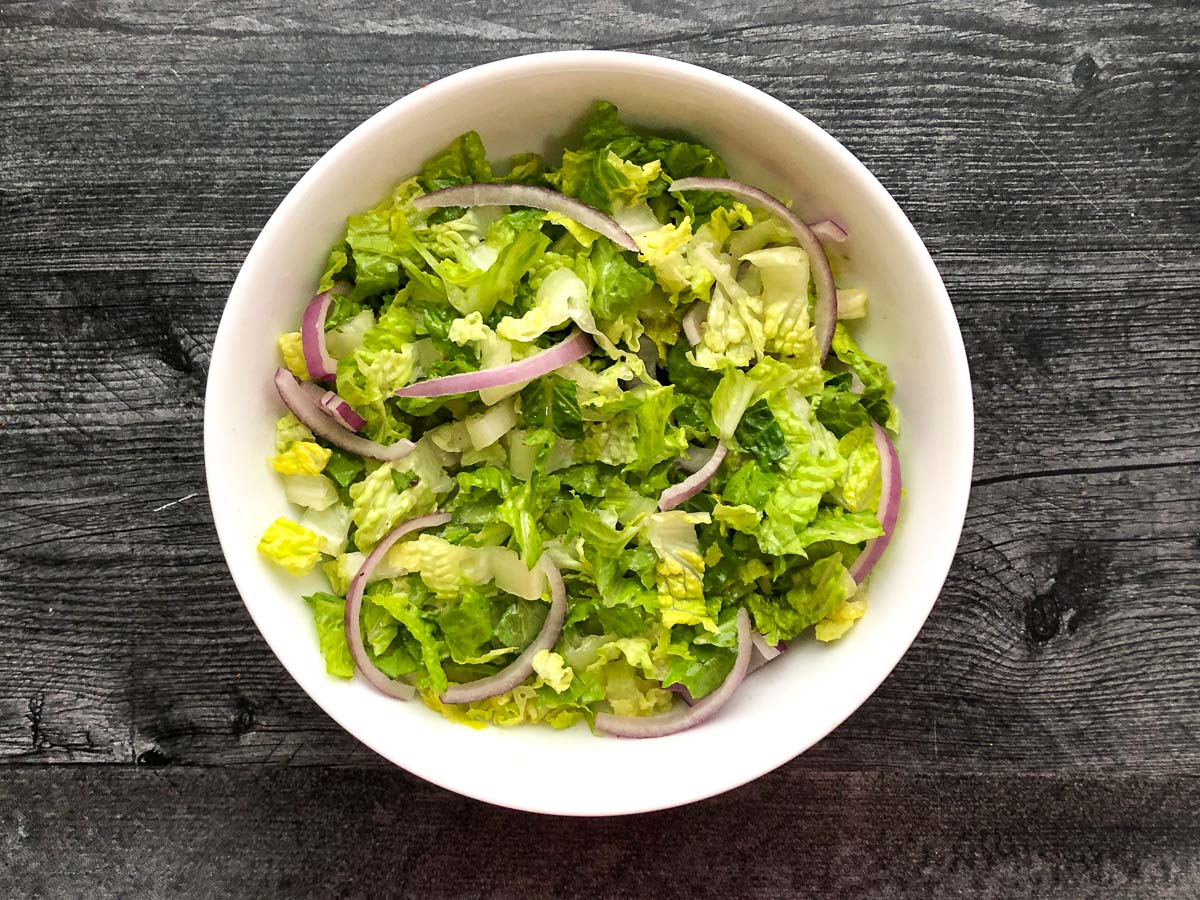 white bowl with salad base