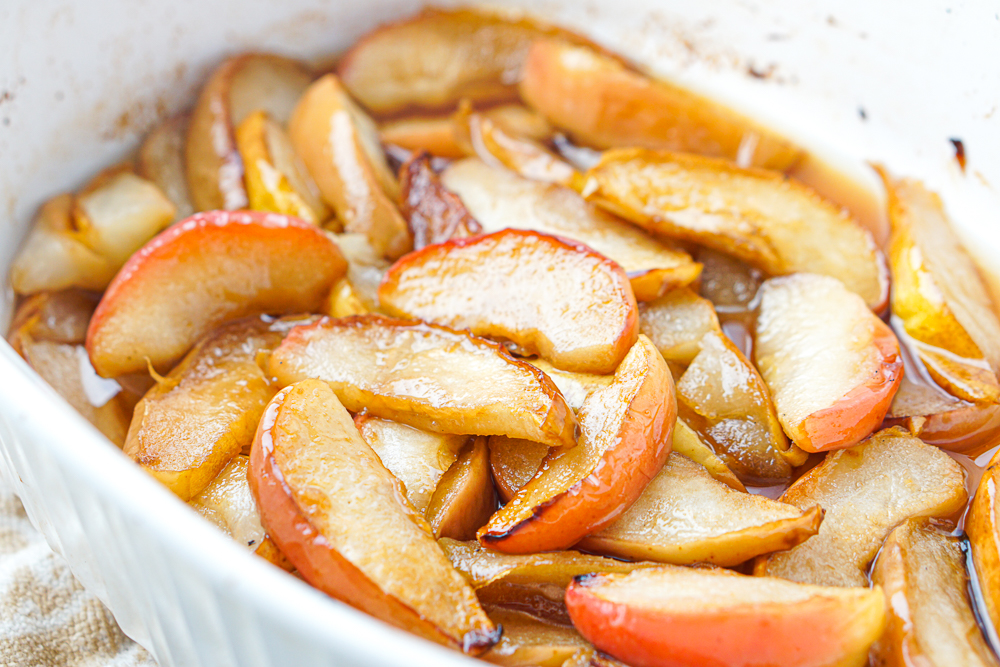 closeup of a baking dish with the baked fruit slices