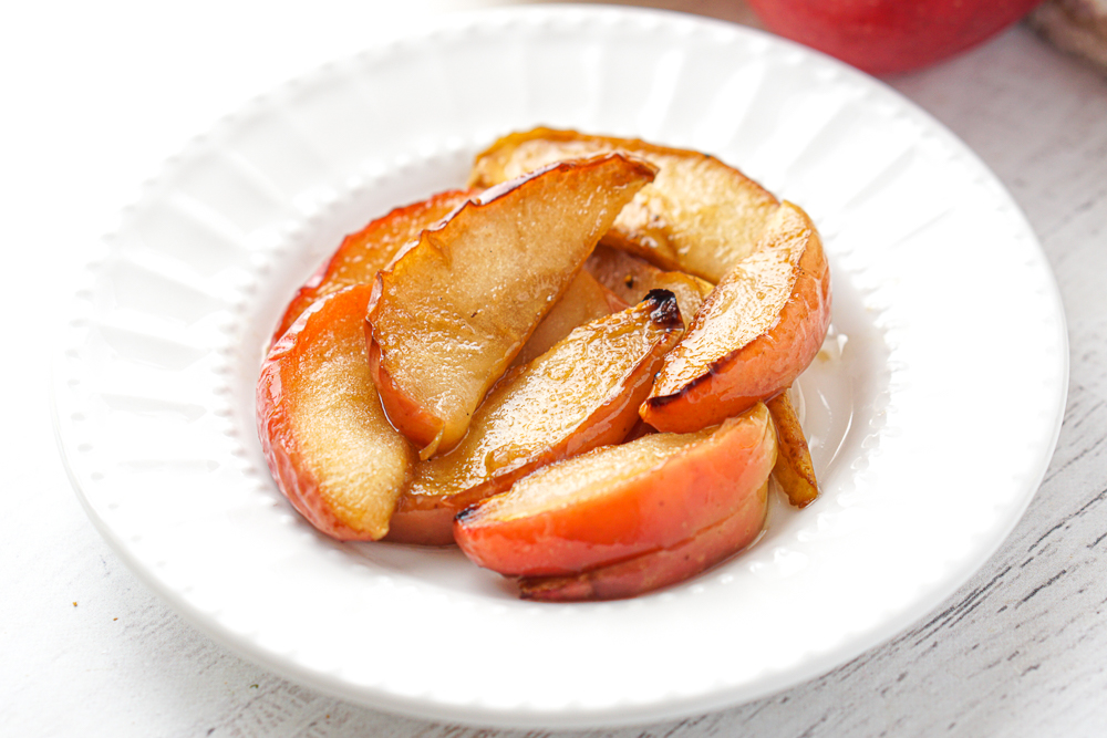 white plate with baked pear and apples