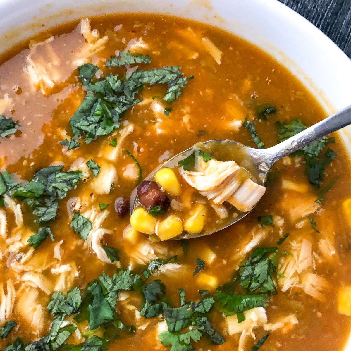 bowl with a spoonful of chicken green enchilada soup