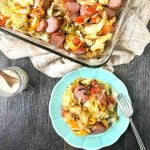 baking dish and blue plate with kielbasa & cabbage casserole with text