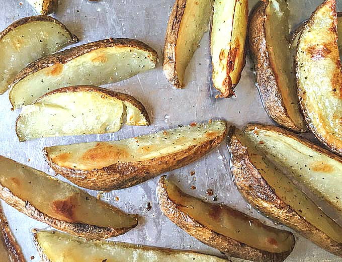 cookie sheet with oven baked crispy steak fries