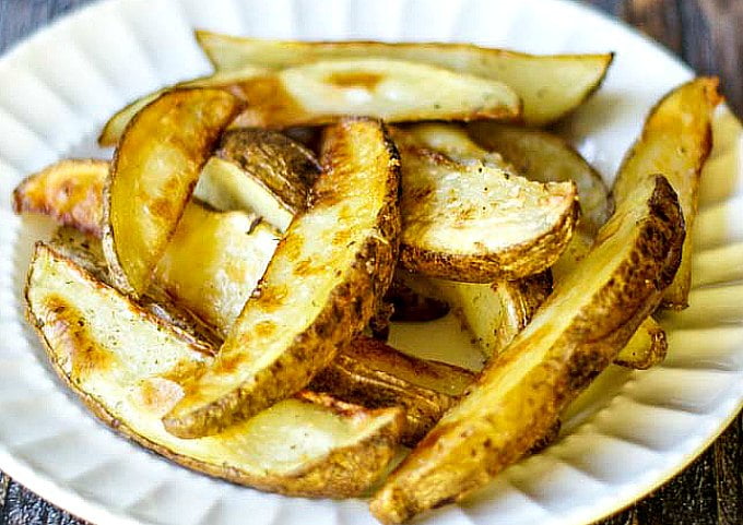 white plate with crispy steak fries