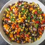 Mexican Bean Salad is perfect for summer picnics and parties that you can make the night before. The festive colors & delicious taste are sure to be a hit.