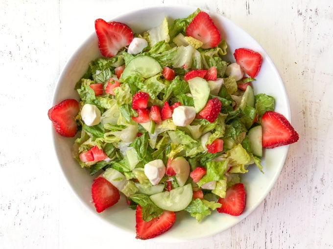 white bowl with strawberry caprese salad