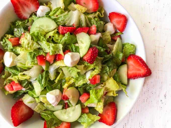 closeup of a bowl of strawberry caprese salad