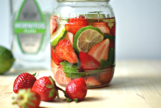 These fruit & herb infused liquors are a fun way to use all that ripe and luscious summer fruit. I have  three delicious flavors for you: strawberry basil gin, apricot ginger vodka and strawberry lime tequila!