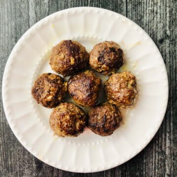 white plate with keto middle eastern meatballs