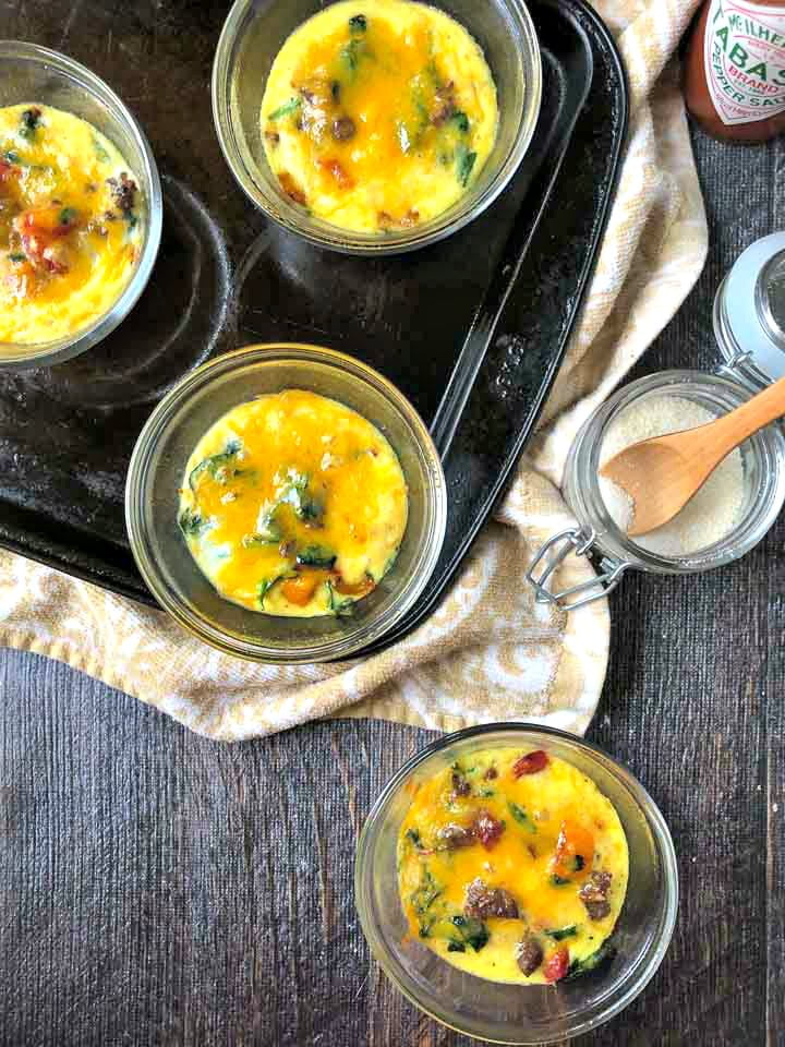 glass custard cups on a cookie sheet with make ahead omelets 