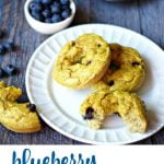 Long photo of blueberry bagels on plate with blueberries in background and text overlay.