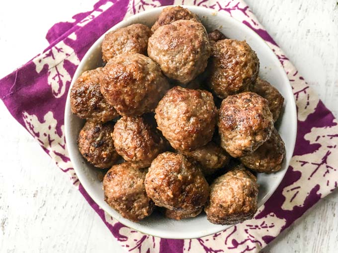 Close-up of a bowl  of meatballs with a  bowl of meatballs.