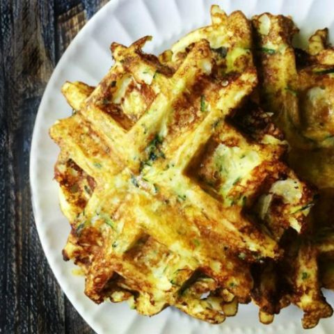 These savory zucchini waffles are gluten free and low carb. They make a great low carb breakfast or snack and you can even freeze them for later. Only 5 ingredients and 3.1g net carbs per waffle.