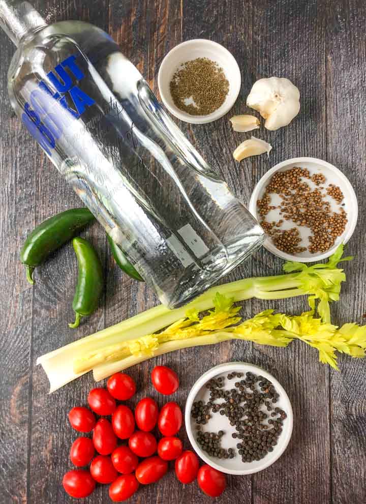 ingredients for a Bloody Mary infused Voka drink: Absolut vodka, jalapenos, celery seed black pepper corns, garlic tomato and celery