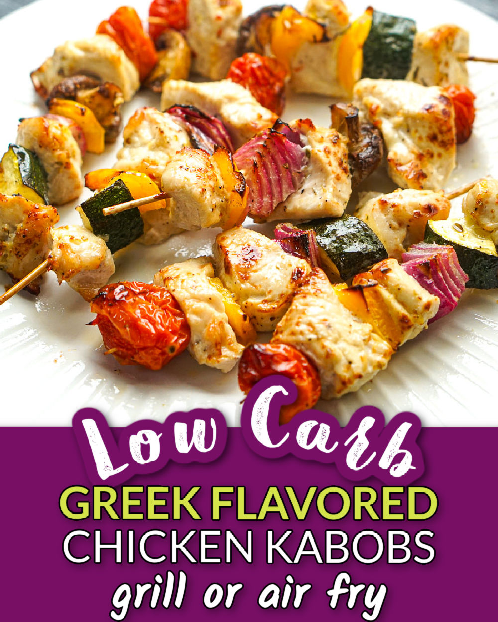 White plate with a skewers of keto Greek Chicken kabobs and text overlay.