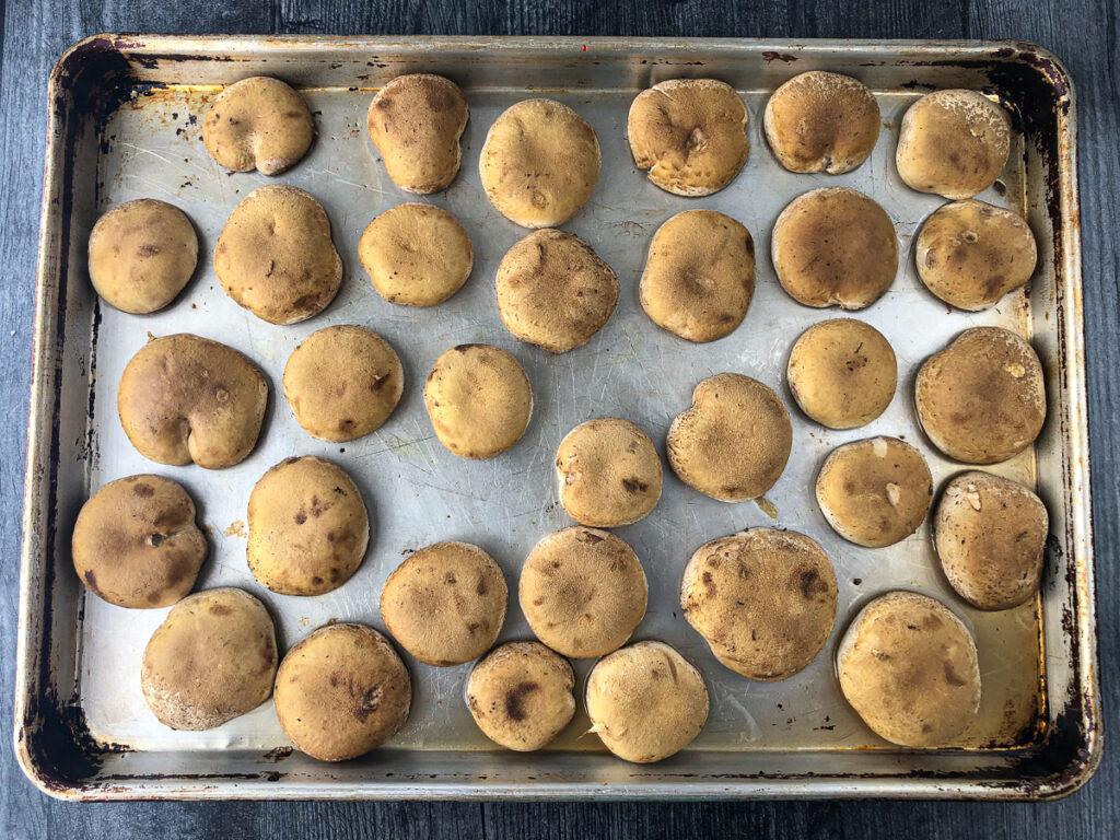 baking sheet with cooked mushroom caps