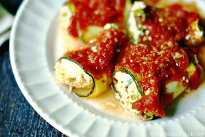These herb stuffed zucchini rolls are much like a cheese stuffed ravioli but without the pasta. It's a delicious gluten free, vegetarian meatless meal!