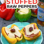 Aqua plate with an antipasto stuffed raw pepper cut in half and text.