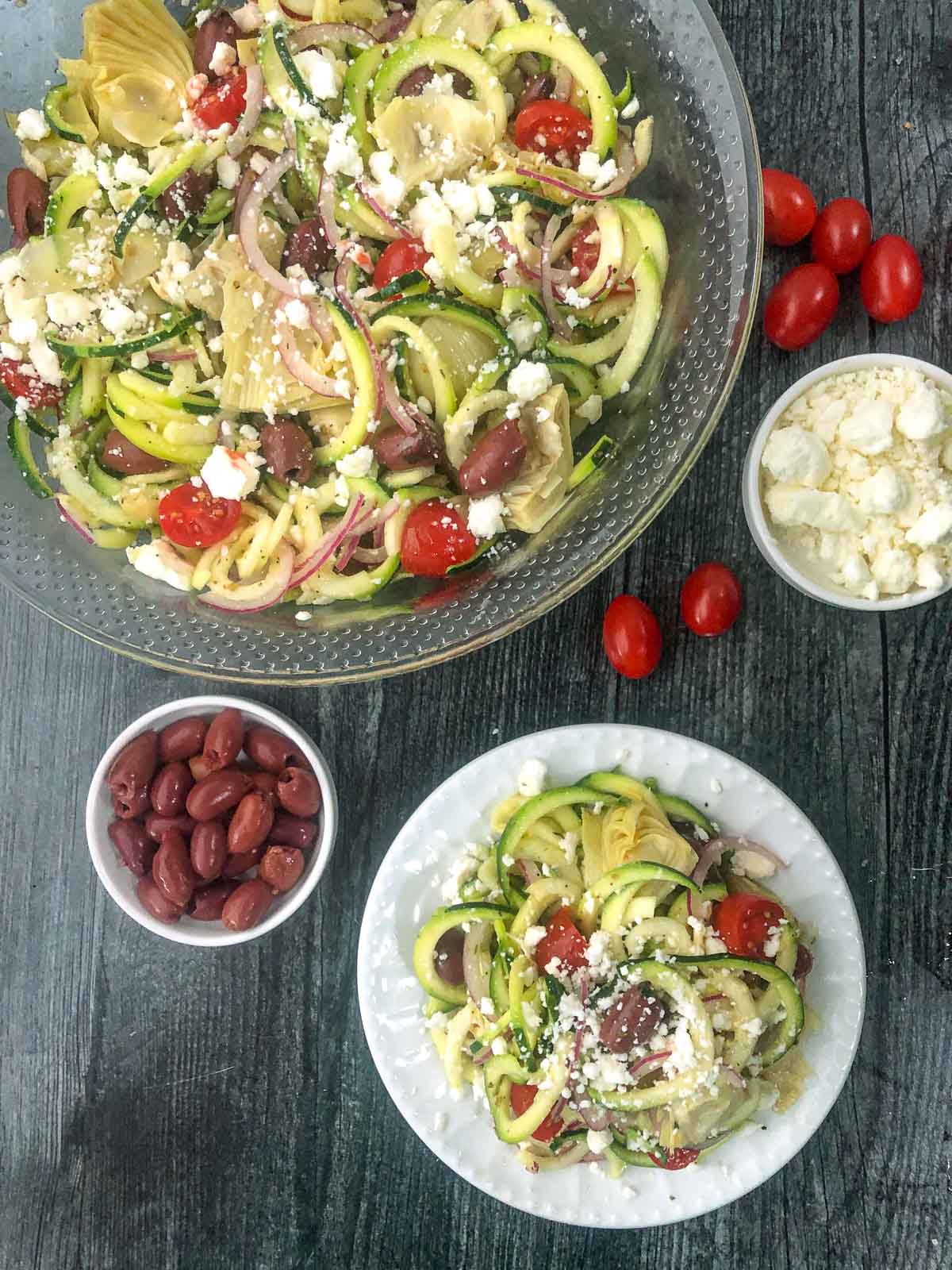 aerial view of zucchini noodles salad with fresh feta and greek olives