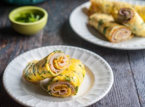 This herb turkey egg wrap is a delicious low carb breakfast. Making the wrap out of eggs and herbs and then filling with turkey and cheese. Only takes minutes too!