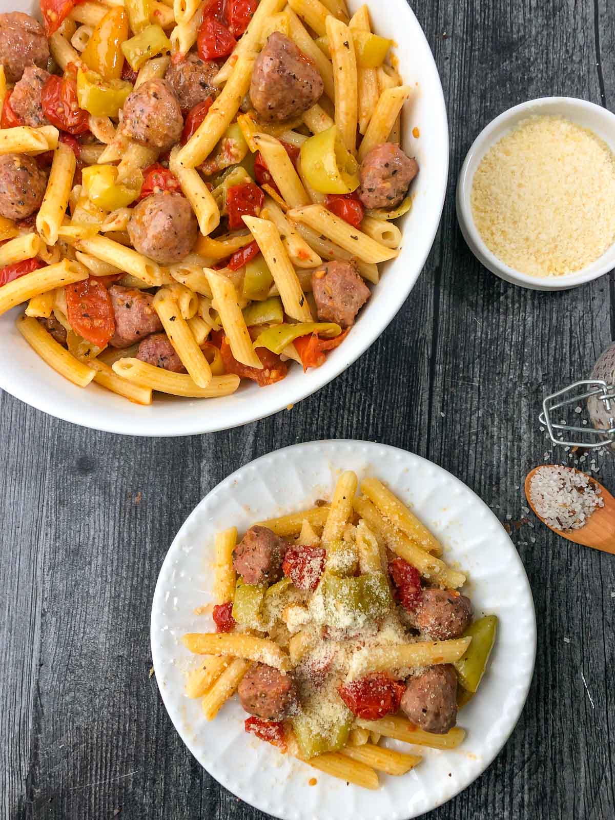 aerial view of a white bowl and plate with stuffed banana pepper pasta