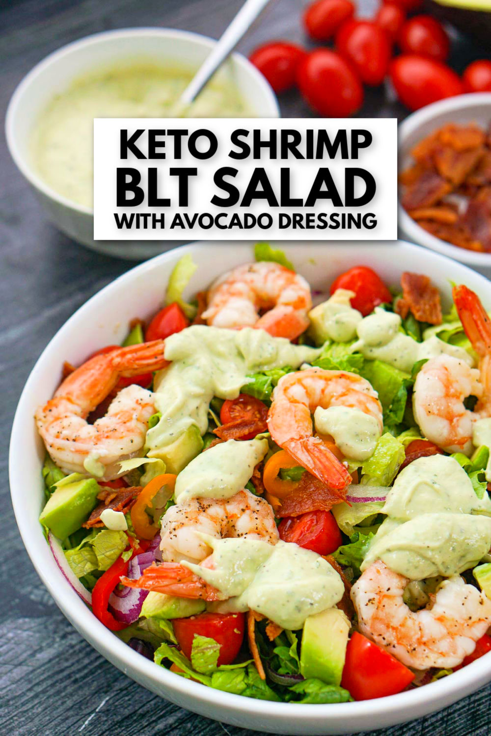 white bowl with keto shrimp and avocado salad and dressing in background and text