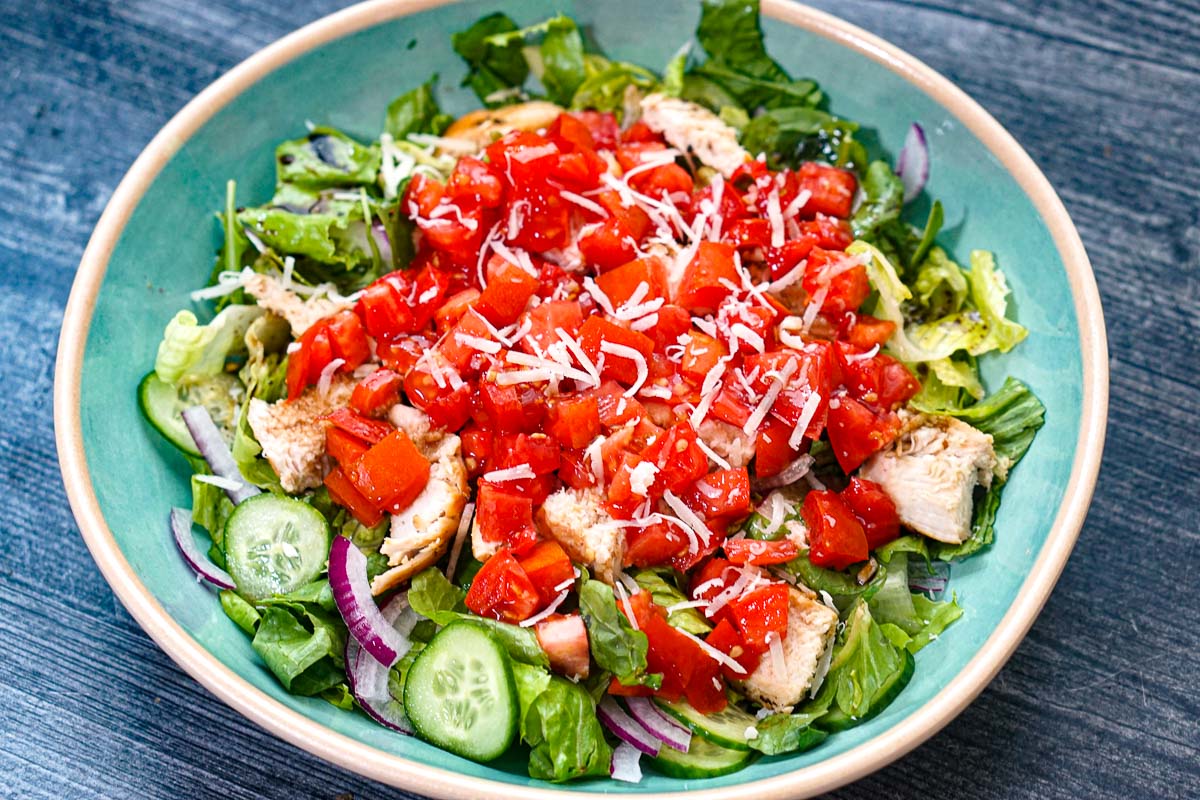 The finished chicken bruschetta salad with grilled chopped chicken.