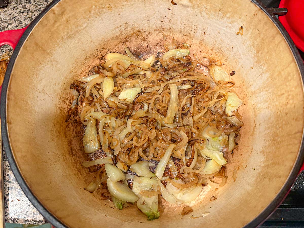 salted onions and fennel in dutch oven pot