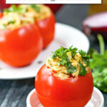 closeup of a curry chicken salad stuffed tomato and text